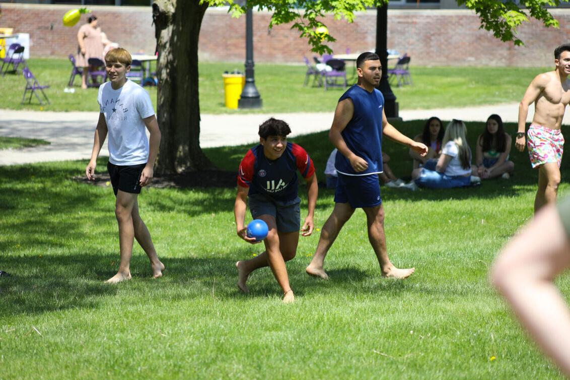 Students play water balloon dodge ball during May Days